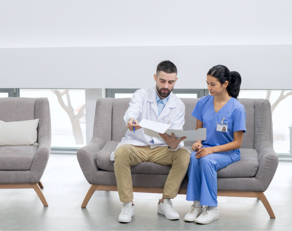 Healthcare professionals reviewing project documents together